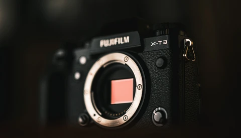 Fujifilm X-T3 camera body with open shutter, showing the sensor and mirror box against a dark background.