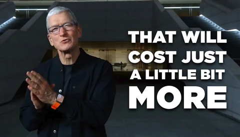 Man in dark jacket and glasses gesturing while speaking, with white text overlay reading "THAT WILL COST JUST A LITTLE BIT MORE."