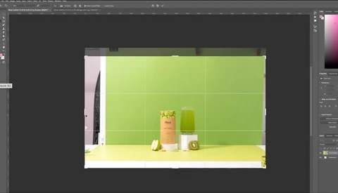 Screenshot of product photography setup in Adobe Photoshop with a cosmetic product displayed against a bright green background.