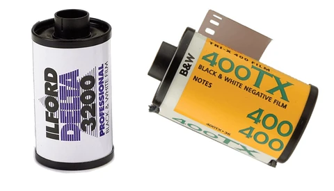 Two film canisters: a Ilford HP5 black and white 35mm film roll on the left, and a Kodak Portra 400 color negative film roll on the right.