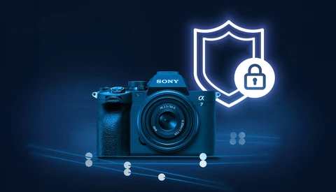 Blue Sony mirrorless camera with security shield and padlock icon on dark background.