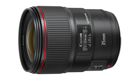 Canon 35mm prime lens with red ring and autofocus mechanism visible on black barrel.