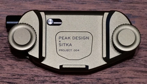 Peak Design x Sitka Project.004 camera control device with symmetrical dual knobs and titanium finish.