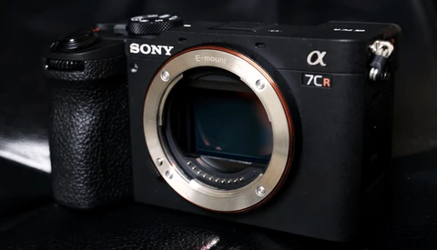 Sony α7CR mirrorless camera body with lens mount visible against dark background.