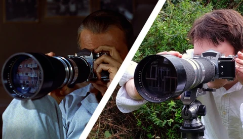 Two photographers holding vintage telephoto lenses with tripod mounts, demonstrating manual focus technique.