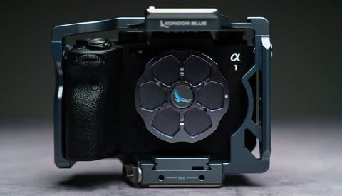Sony alpha camera rig with custom cage and accessory mounting system viewed from above.