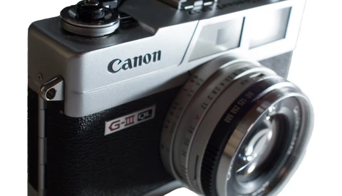 Canon Canonet G-III QL17 rangefinder camera with fixed lens, featuring black body and silver top plate.