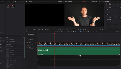 Screenshot of video editing software showing a male presenter in the preview window with timeline tracks below containing video and audio clips.