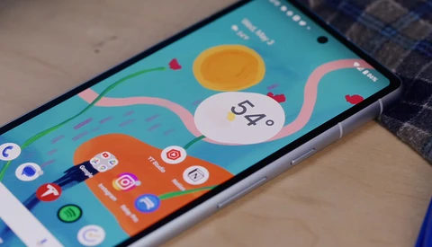Screenshot of a smartphone home screen displaying a weather app with a 54-degree temperature reading and colorful weather icons.