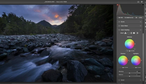 Screenshot of photo editing software showing a long-exposure landscape photograph of a rocky river at dusk.
