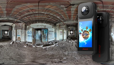 360-degree camera device displayed next to an expansive panoramic photograph of an abandoned, deteriorating interior space.