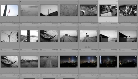 Contact sheet of black and white film negatives displaying architectural and landscape photography across multiple rows.
