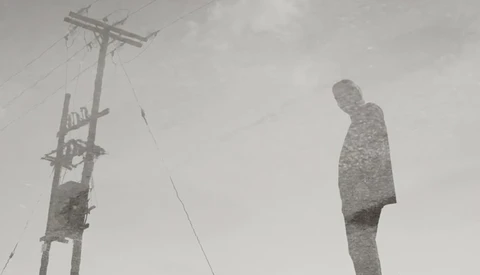 Surreal double-exposure composite showing a figure merged with textured landscape against an overcast sky with utility pole.