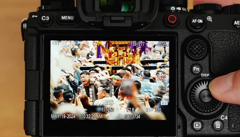 Camera rear LCD screen displaying a multi-angle video recording interface with timestamp and metadata overlays.