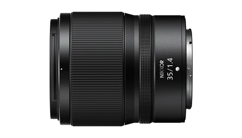 Nikon Z 35mm f/1.4 lens with ribbed focus ring and depth-of-field markings, photographed against white background.
