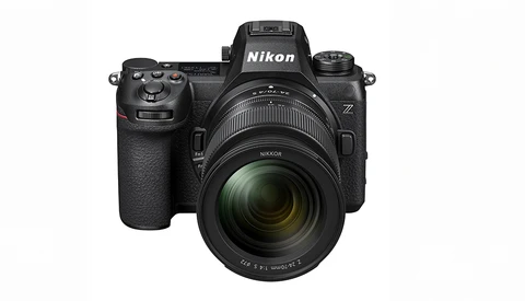 Nikon Z mirrorless camera with attached zoom lens, front three-quarter view against white background.