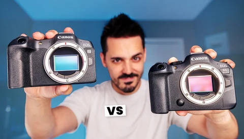 Photographer holding two Canon mirrorless cameras with different colored sensor displays, separated by "vs" text.