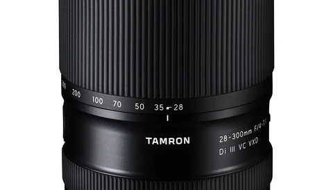 Tamron 28-75mm f/2.8 zoom lens with black barrel and ribbed texture against white background.