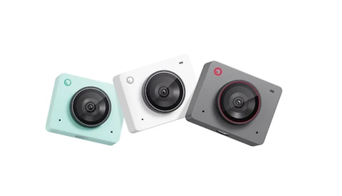 Three compact digital cameras in mint, white, and dark gray with red accents, arranged in a row.