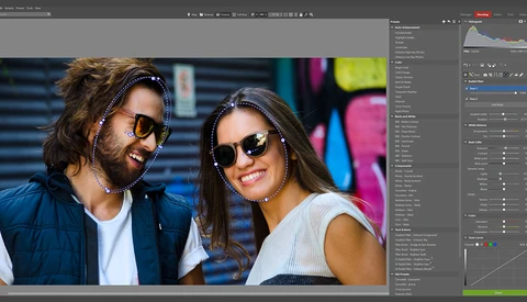 Screenshot of photo editing software showing a portrait of two people wearing sunglasses outdoors.
