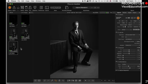 Screenshot of photo editing software displaying a black and white portrait of a man in business attire seated against a dark background.