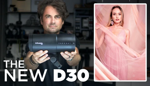 Photographer holding a Profoto D30 flash unit with product comparison image on right.