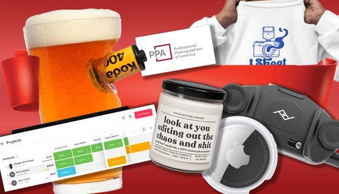Flat lay composition of creative and business items on red background including beer, headphones, notebook, and branded materials.
