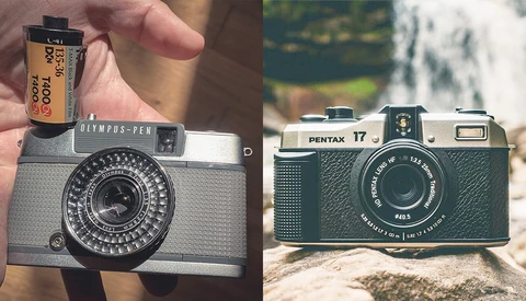 Two vintage film cameras displayed side by side with expired film stock held above the left camera.