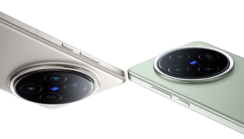 Close-up comparison of two smartphone camera systems with circular lens arrays and metallic rings.