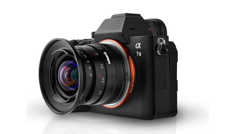 Sony α7R mirrorless camera with wide-angle lens attached, shown against white background.