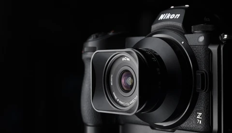 Nikon Z7 II mirrorless camera with attached lens, photographed against a black background.