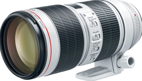 White telephoto zoom lens with black barrel sections and control rings, shown against white background.