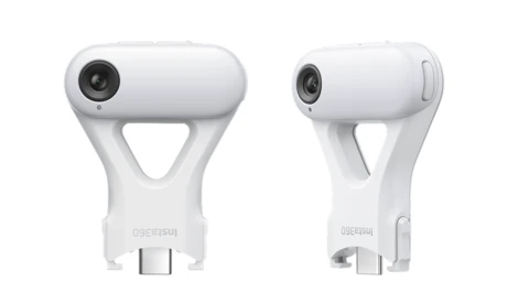 Two white smartphone-mounted camera accessories shown front and side views, featuring circular lens openings and triangular handle cutouts.