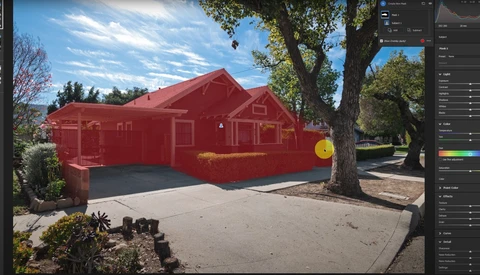 Red house with selection overlay displayed in photo editing software interface.