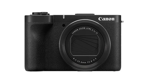 Canon compact digital camera with black textured grip and fixed zoom lens against white background.