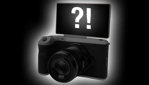 Illustration of a digital camera with a flip-up screen displaying question and exclamation marks.