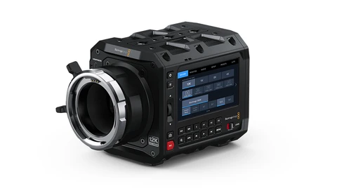 Black cinema camera with articulating lens mount and touchscreen display panel.