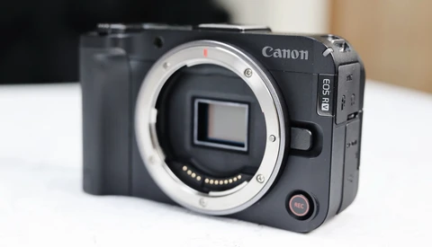 Canon EOS R5C mirrorless camera body with lens mount exposed, displayed against neutral background.