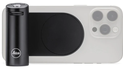 Leica smartphone camera grip mounted on iPhone 14 Pro with black cylindrical lens attachment.