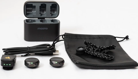 Maono wireless microphone system with charging case, transmitters, receiver, USB cable, and drawstring storage pouch.