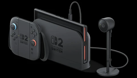 Product photograph of gaming console with detached controllers and wireless headset displayed against black background.
