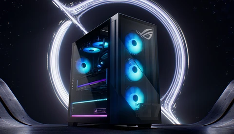 Gaming PC with illuminated blue cooling fans inside a black case, surrounded by a glowing white circular light ring against a dark starry background.