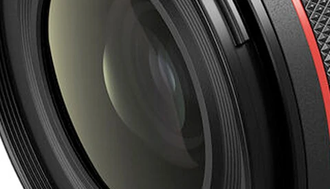 Close-up view of camera lens elements and internal glass components with layered optical surfaces.