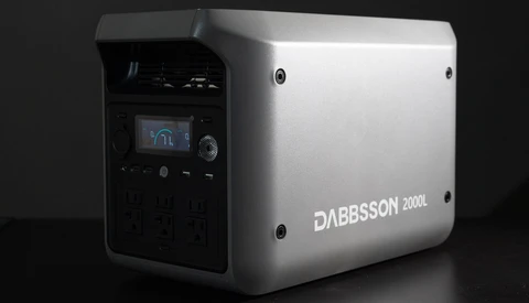 Dabbsson 2000L portable power station with white exterior and black control panel featuring small LCD display.