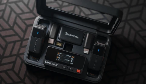 Saramonic wireless microphone system with receiver, transmitter, and accessories displayed in open carrying case.