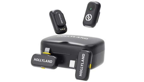 Hollyland wireless microphone system with compact receiver and two transmitter units displayed with charging case.
