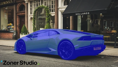 Bright blue sports car parked on a city street lined with storefronts and ivy-covered buildings.