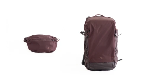 Two burgundy travel bags shown side by side—a compact waist pack on the left and a larger convertible backpack on the right.