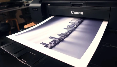Canon printer outputting a black and white contact sheet of film negatives.
