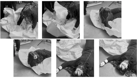 Six black and white contact sheet frames showing a person in white fabric on gray ground from multiple angles.